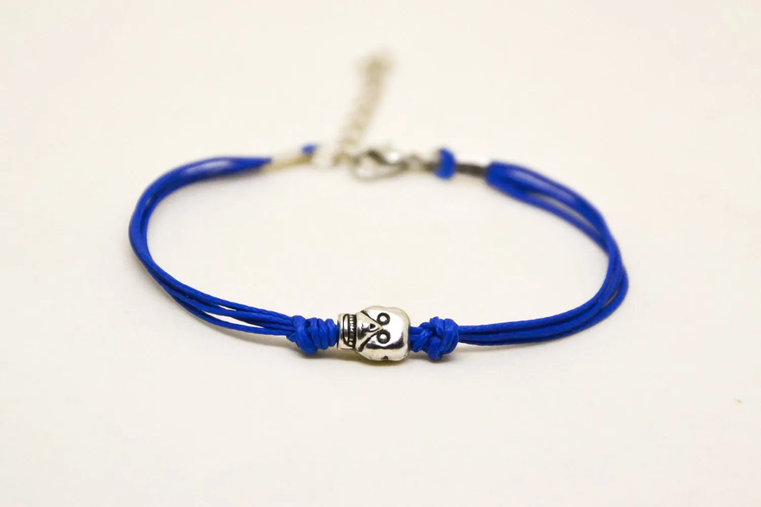 Silver skull bead bracelet, blue cord, gift wrapped