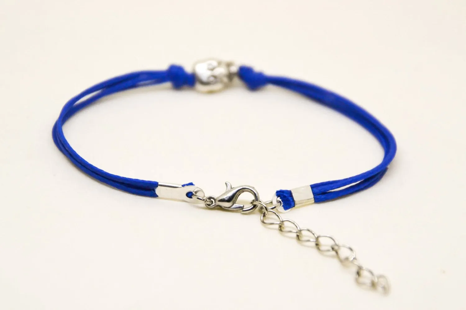 Silver skull bead bracelet, blue cord, gift wrapped