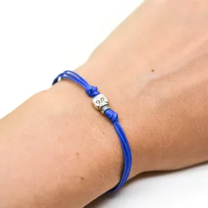 Silver skull bead bracelet, blue cord, gift wrapped